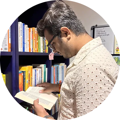 Daksh browsing a bookshelf