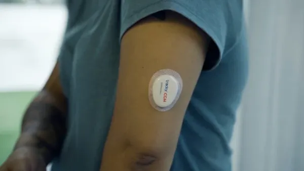 CGM sensor on arm during the 15-day wear period